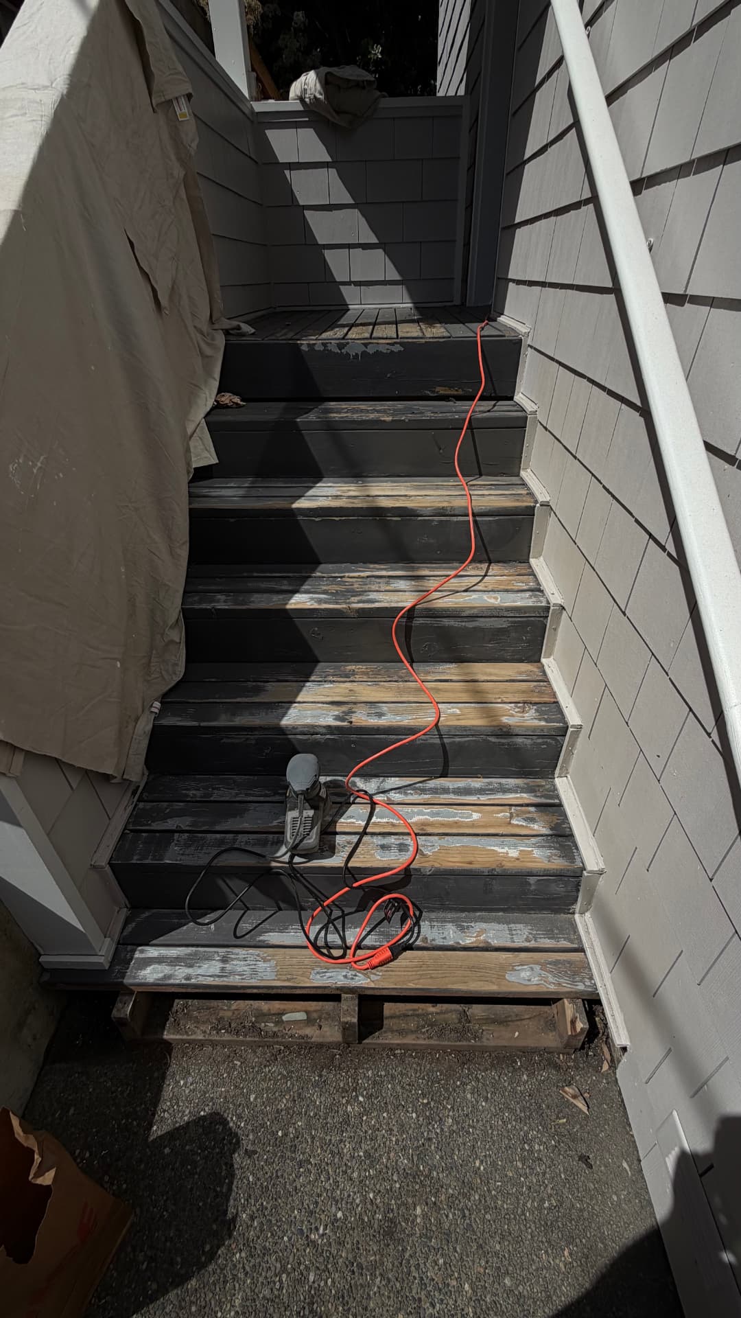 Front entry stairs before and after refinishing — before